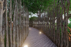 4 bedroom tree-hugging home in amenity filled community steps from the beach